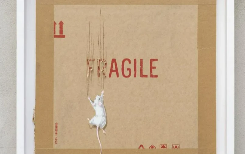 50 serigraphs by the British artist were up for auction, estimated at £5,000 each. The work represents a white mouse with its hooves tearing a cardboard with the inscription _Fragile_