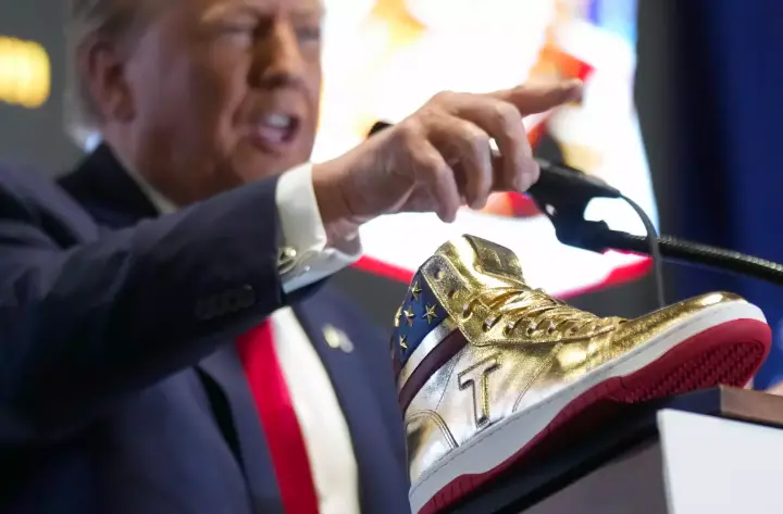 Trump touts his 9 branded sneakers after million-dollar fines